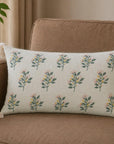 Poppy Whim hand embroidered ivory lumbar cushion with floral motifs and tassel corners