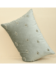 Hand-embroidered evil eye cushion cover on mint green velvet, 14x20 size, adding elegance and protection to any space.