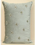 Hand-embroidered mint green velvet cushion cover featuring an evil eye design and decorative beads, 14x20 size.