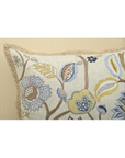 Close-up of Vine cushion featuring colorful floral embroidery and intricate detailing on soft cotton fabric.