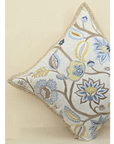 Vine cushion featuring colorful floral embroidery and jute trim, perfect for home decor and cozy living spaces.