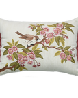 Decorative pillow with bird and floral design on a white background