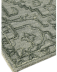 Loop-on-loop texture detail of olive Persian wool rug