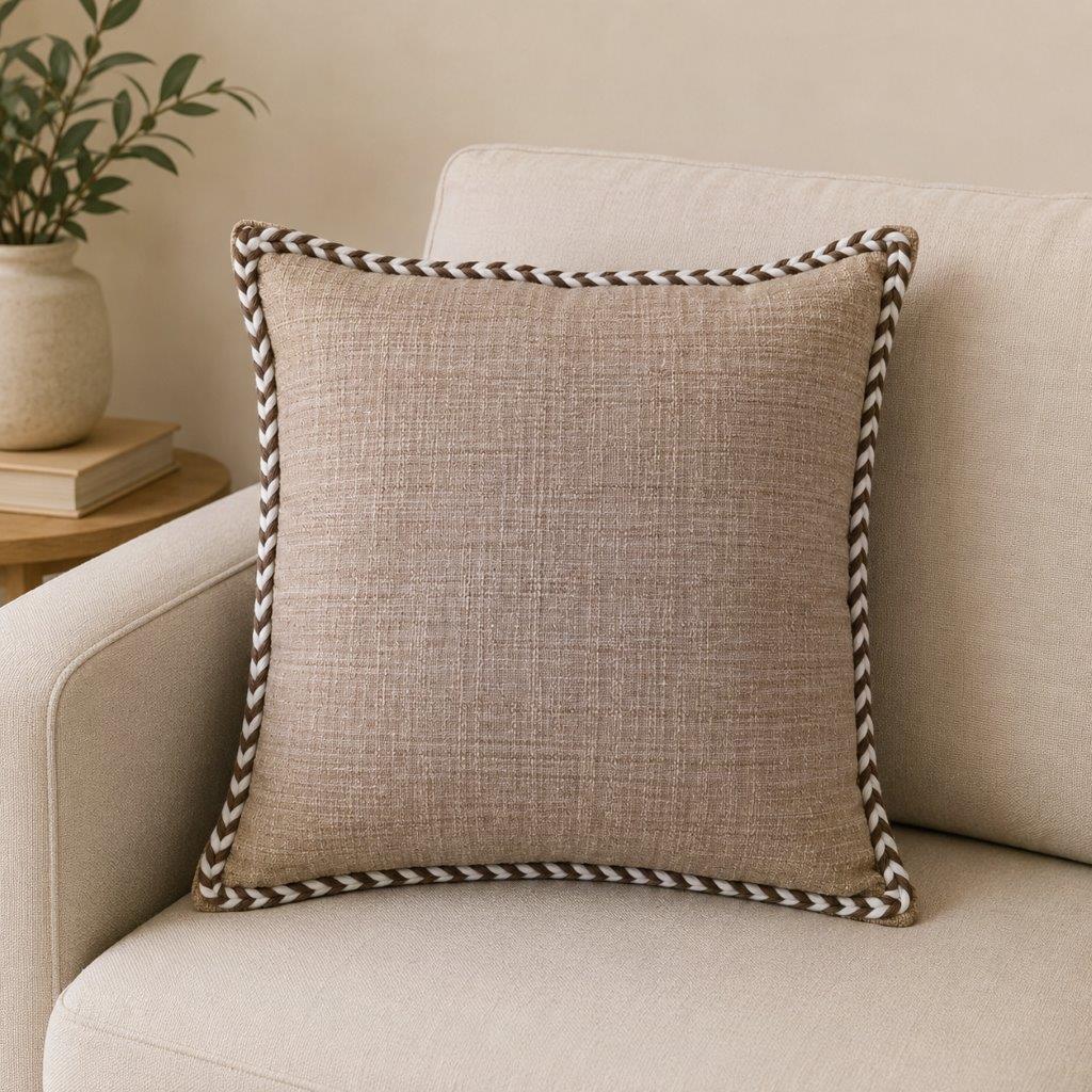 Sahara Weave beige cotton cushion cover with contrast piping on sofa