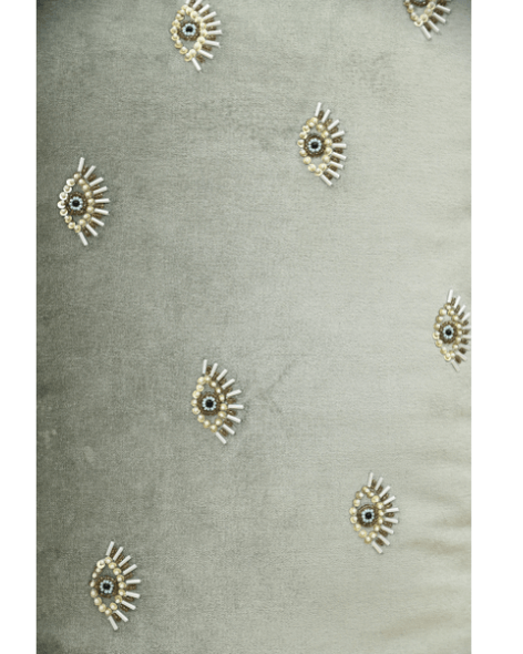 Hand-embroidered evil eye cushion cover on mint green velvet, featuring beads and sequins for elegance and protection.