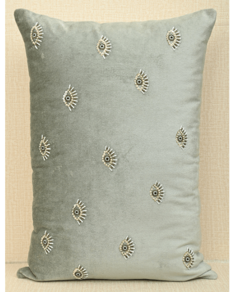 Hand-embroidered mint green velvet cushion cover featuring an evil eye design and decorative beads, 14x20 inches size.