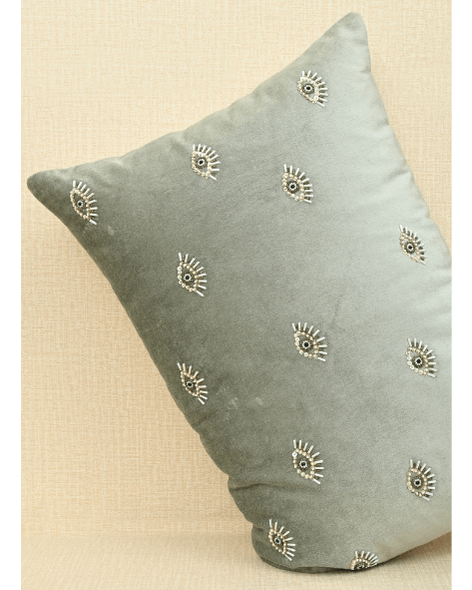 Hand-embroidered evil eye cushion cover in mint green velvet, adorned with beads and sequins, 14x20 inches size.