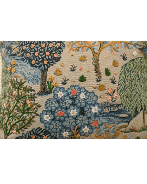 Bough cushion with intricate tree and floral design in vibrant colors, featuring French knots and a natural aesthetic.