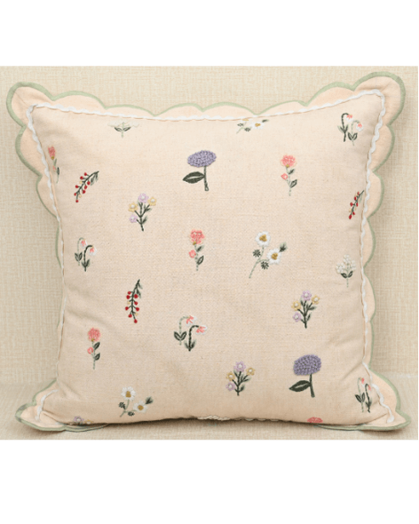 Tea Rose cushion with pink floral motifs in lavender and peach, featuring scalloped edging for elegant home decor.