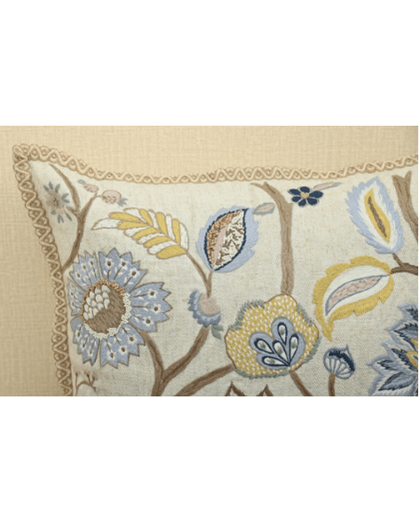 Close-up of Vine cushion featuring colorful floral embroidery and intricate detailing on soft cotton fabric.