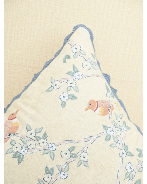 Hummingbirds cushion cover featuring intricate embroidery and blue lace accents, perfect for home decor.