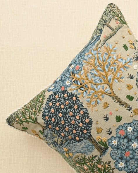 Bough cushion featuring intricate tree and branch print with French knots, adding elegance to home décor.