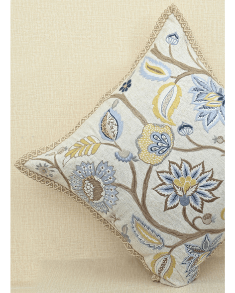 Vine cushion featuring colorful floral embroidery and Jute trim, perfect for home decor and cozy living spaces.