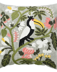 Embroidered pillow with a toucan and floral design on a white background