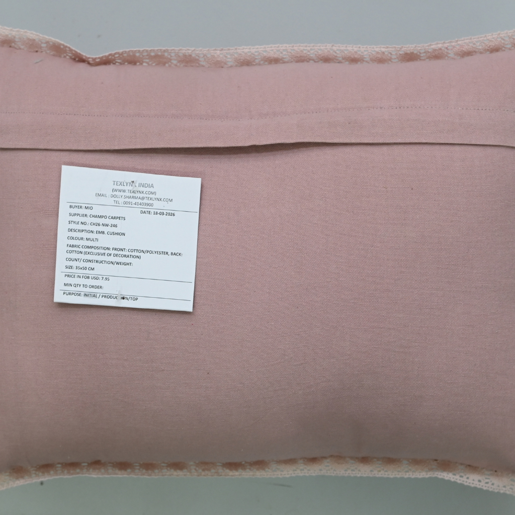 Pink pillow with a label on a gray background