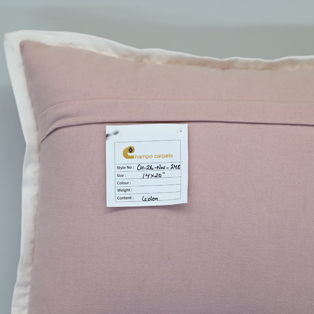 Pink pillow with a label on a gray background