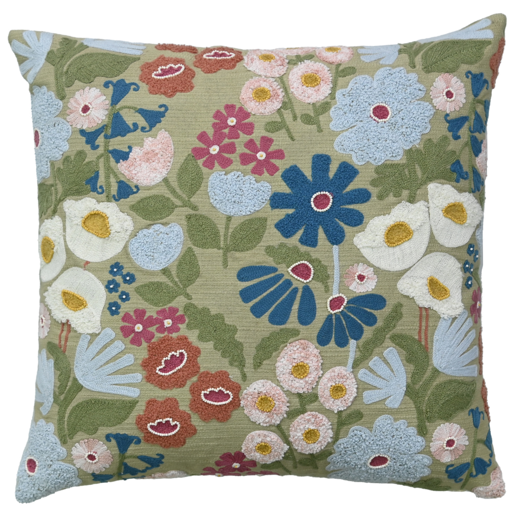 Floral patterned pillow with colorful flowers on a green background
