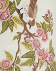 Embroidered fabric with birds and flowers on a branch