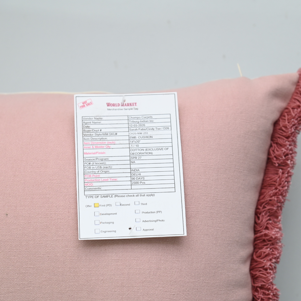Pink fabric with a label on a gray background