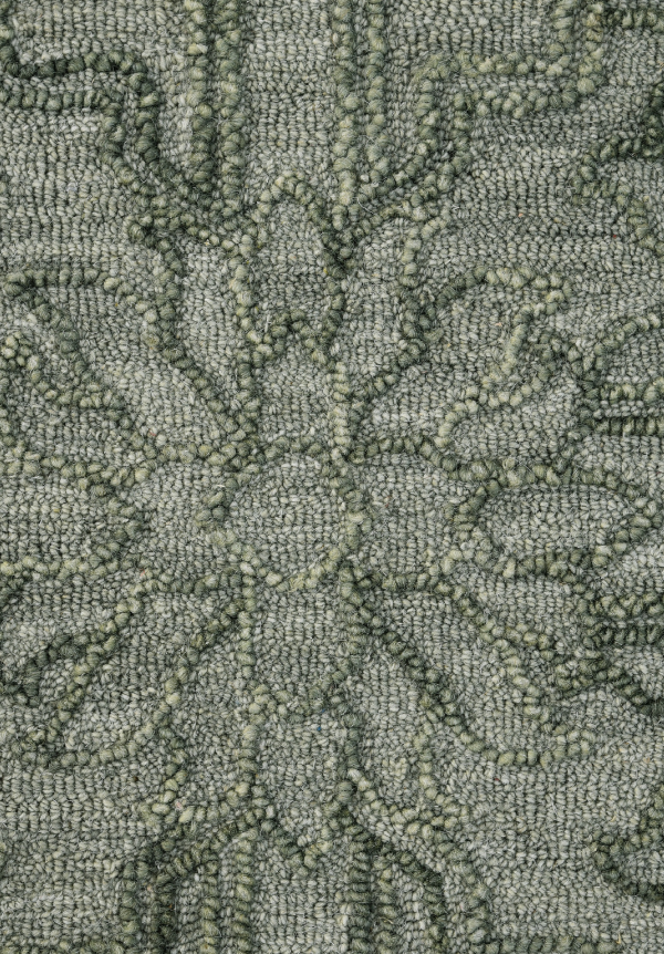 Close-up of Persian motifs on olive hand tufted wool rug