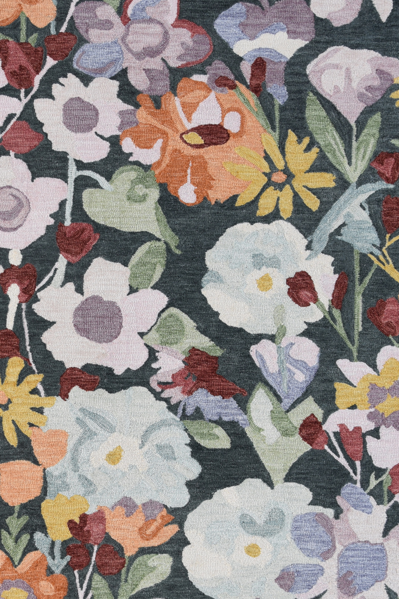 Floral patterned fabric with colorful flowers on a dark background