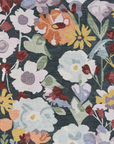 Floral patterned fabric with colorful flowers on a dark background